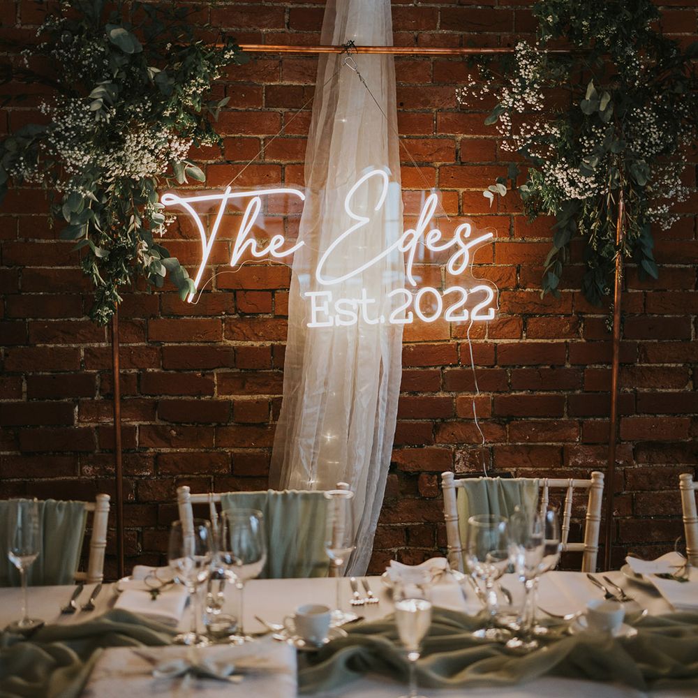 White custom made neon wedding sign on a copper frame for wedding decor and lighting ideas