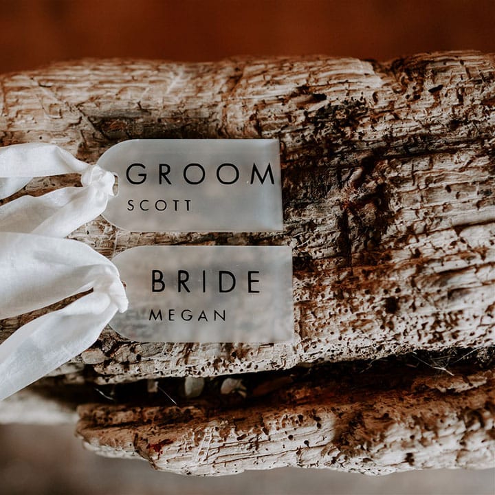 Simple, clean, and minimal wedding table place names with white ribbon detail 