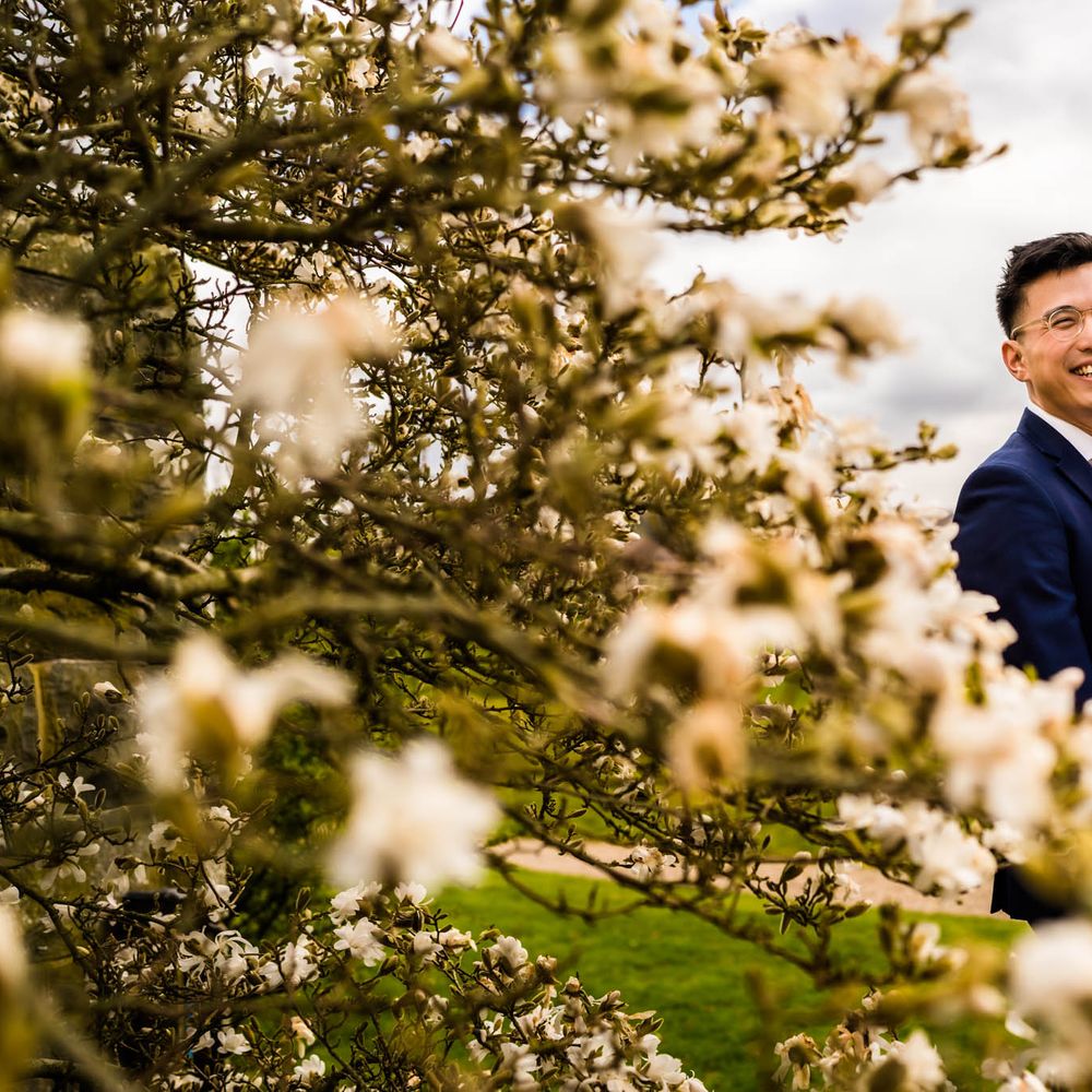 Bride & groom embrace outdoors for couples portraits 