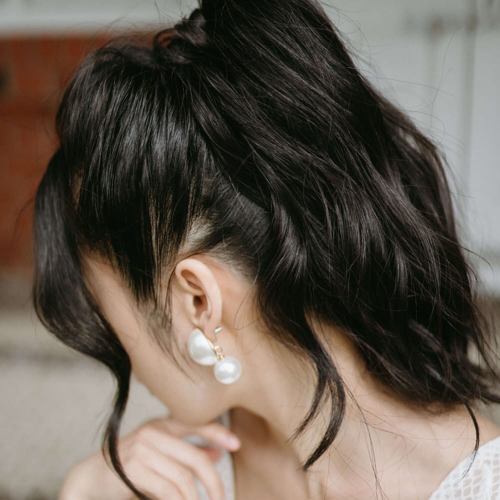 Relaxed wavey high ponytail up do for boho wedding hair at Berwick Lodge