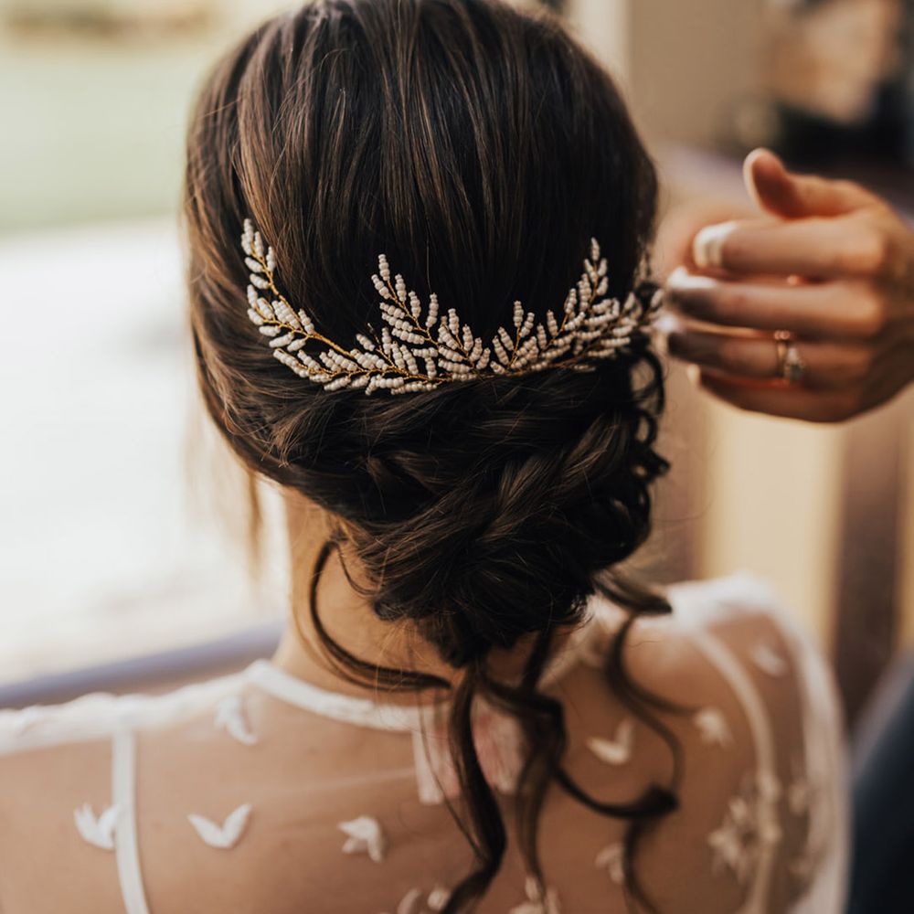 Bridal hair up do with pearl & gold leaf hair accessorie 
