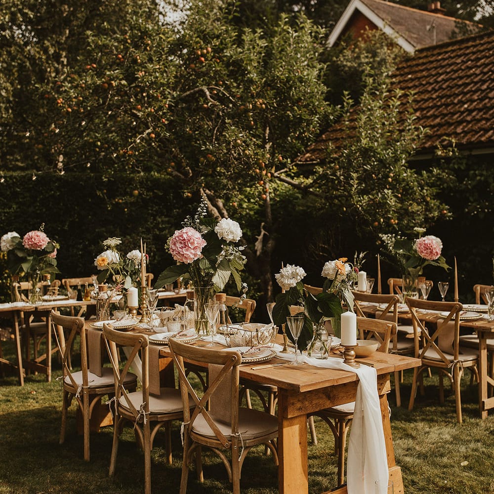 Rustic wooden tables for outdoor intimate reception