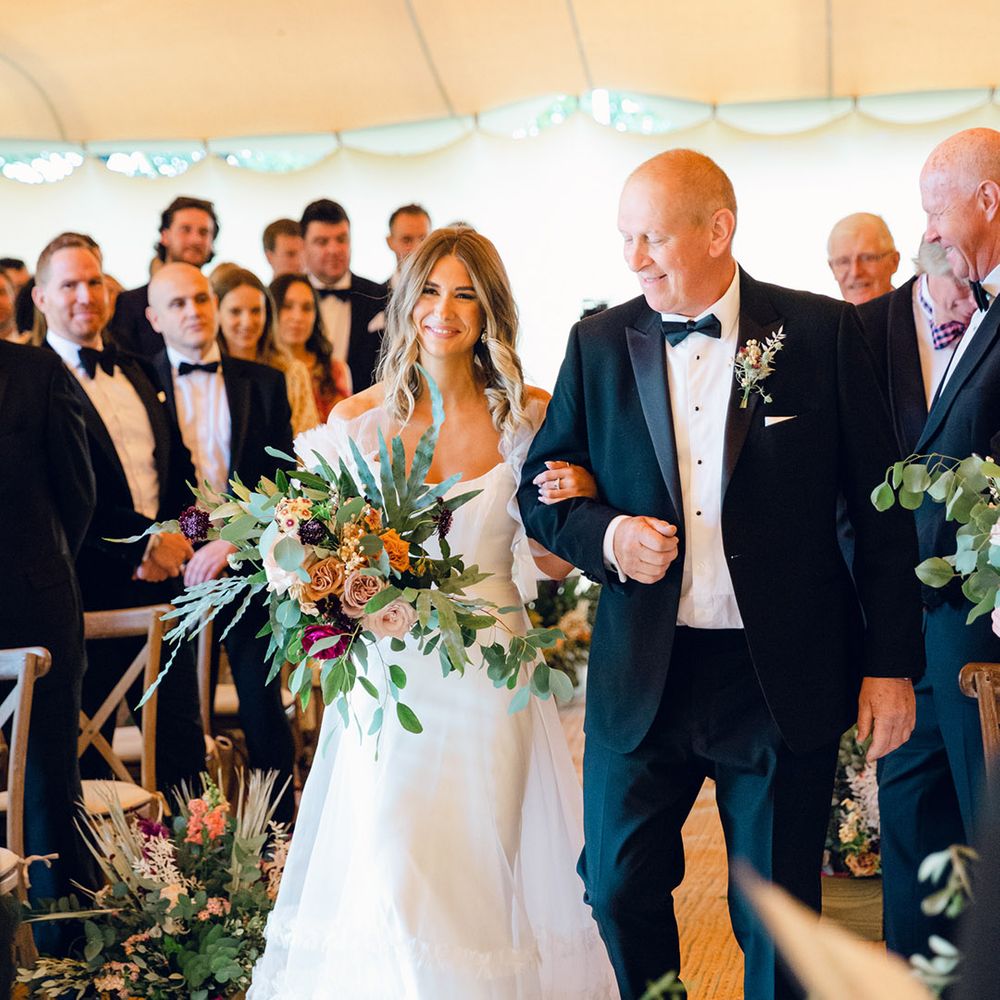 Bride walks down the aisle in Halfpenny London dress 