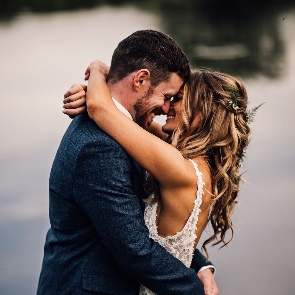 Bride and groom embrace on their wedding day 