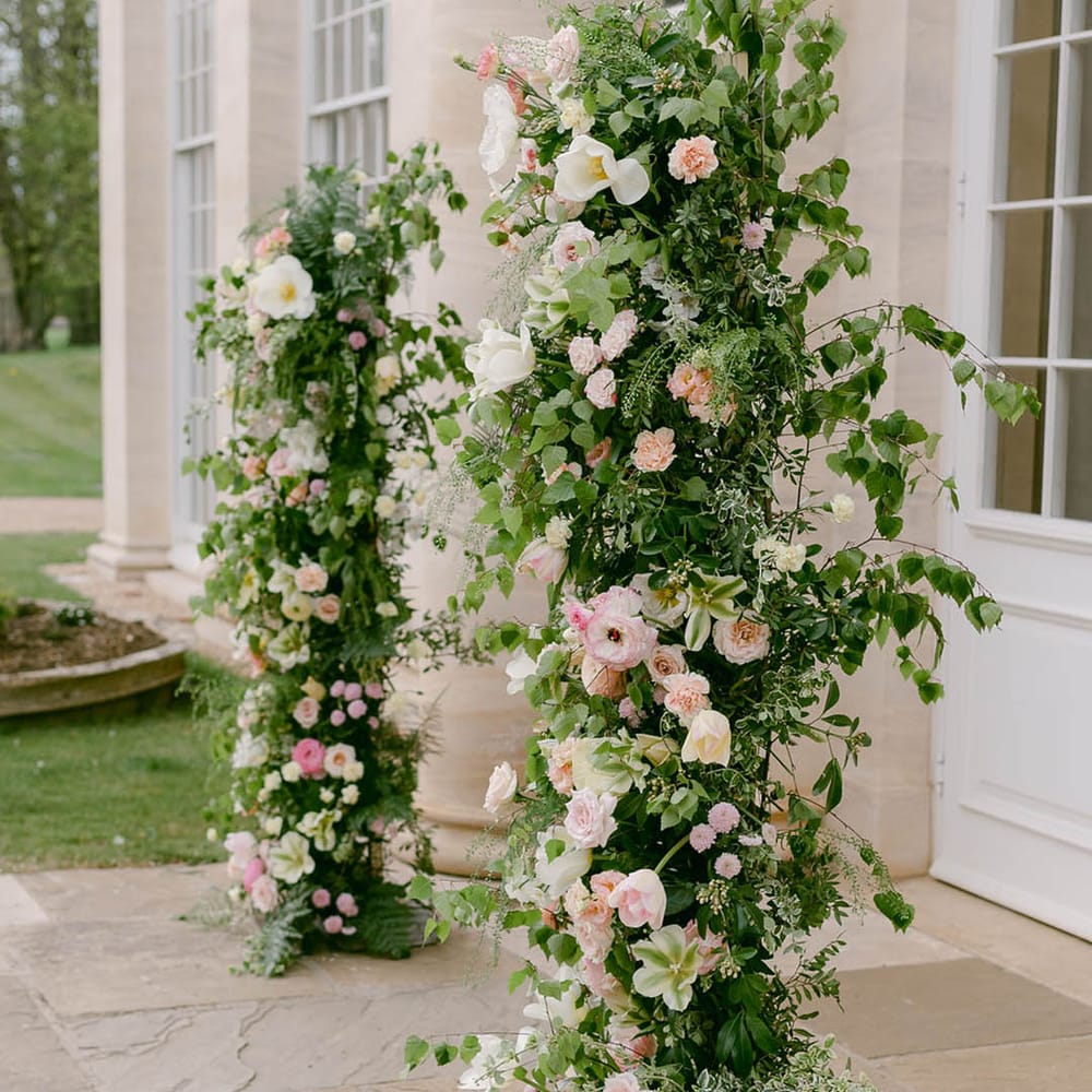 Pink and white wedding flower column decoration 