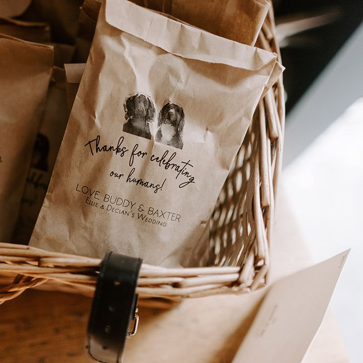 Personalised thank you wedding favours in paper bags with pictures of the couple's pet dogs 