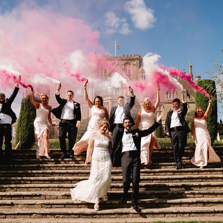 Pink and white smoke bomb wedding photo of the wedding party for pink and Moroccan theme wedding 