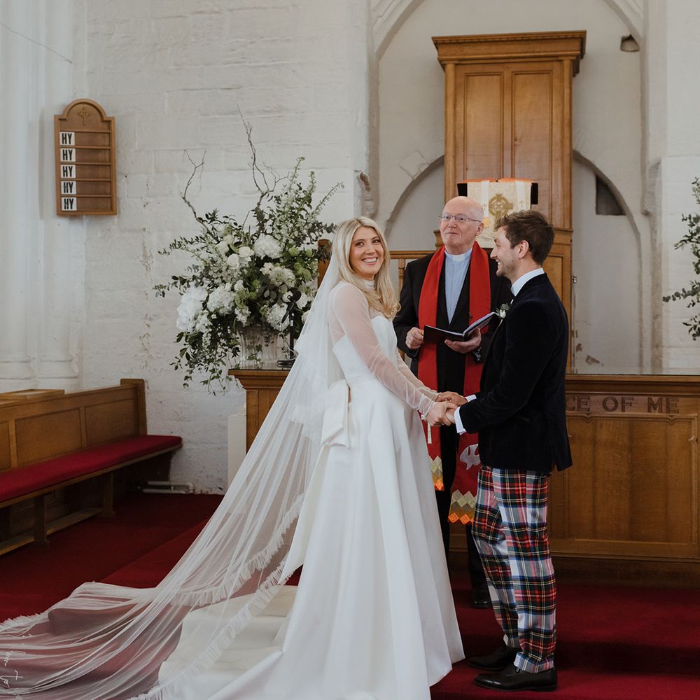 Bride and groom at their church wedding ceremony at St Monans Kirk church 