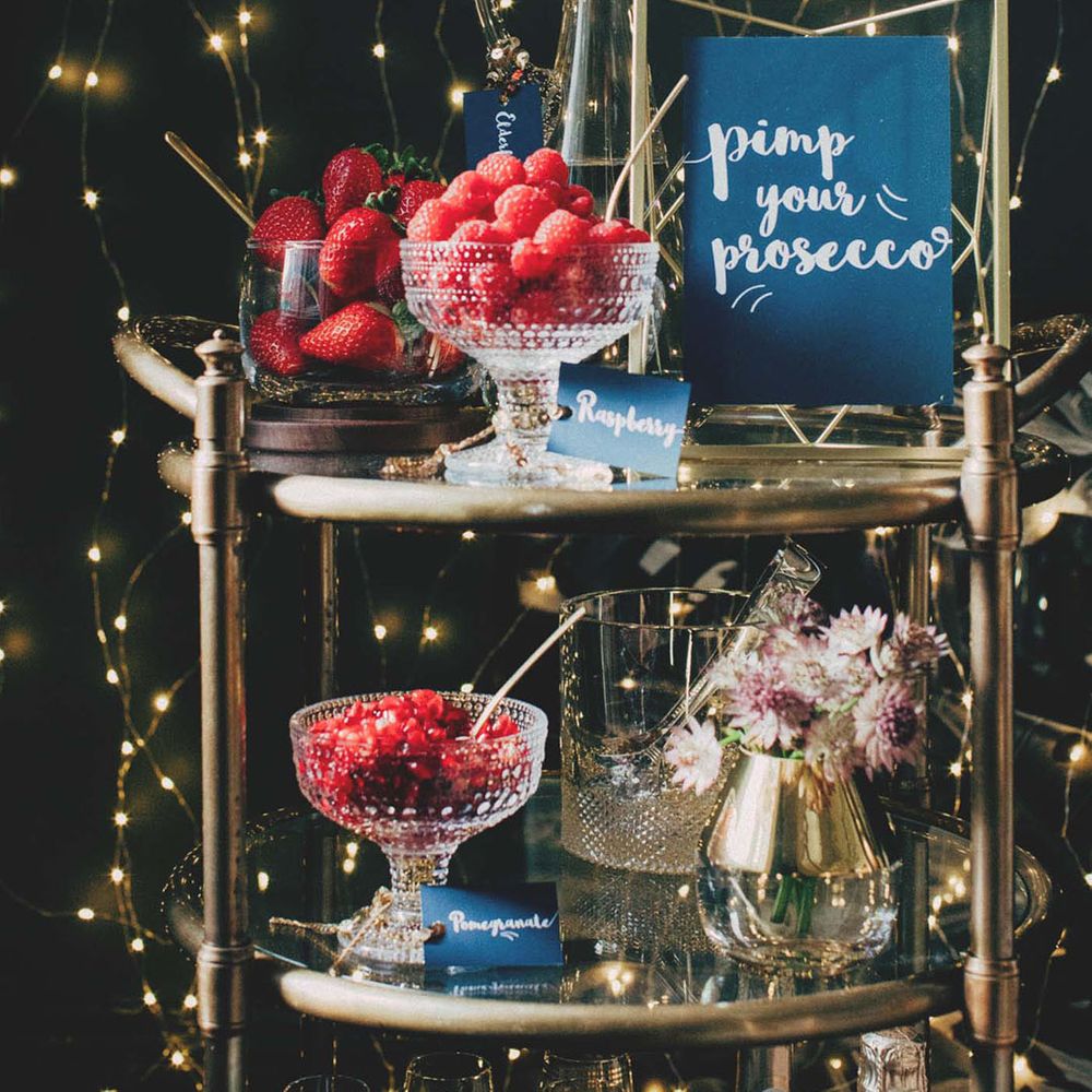 Pimp your Prosecco station with fruit garnishes in bowls with spoons to add to your drink 
