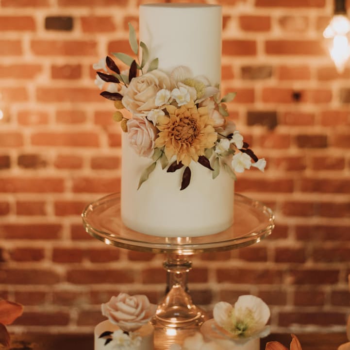 Floral toffee apple and cinnamon wedding cake by Love Wedding Cakes