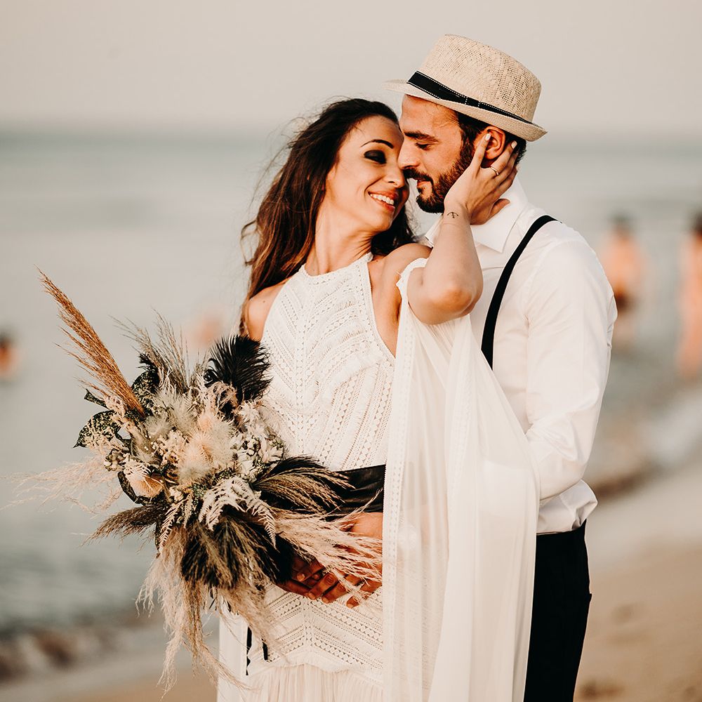 Groom in straw hat at Puglia wedding