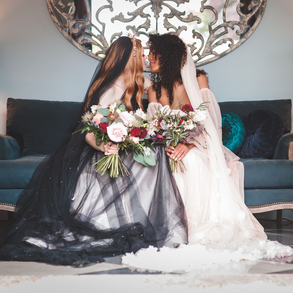 Autism marriage inclusive wedding inspiration at Thicket Priory with two brides kissing in coloured wedding dresses 