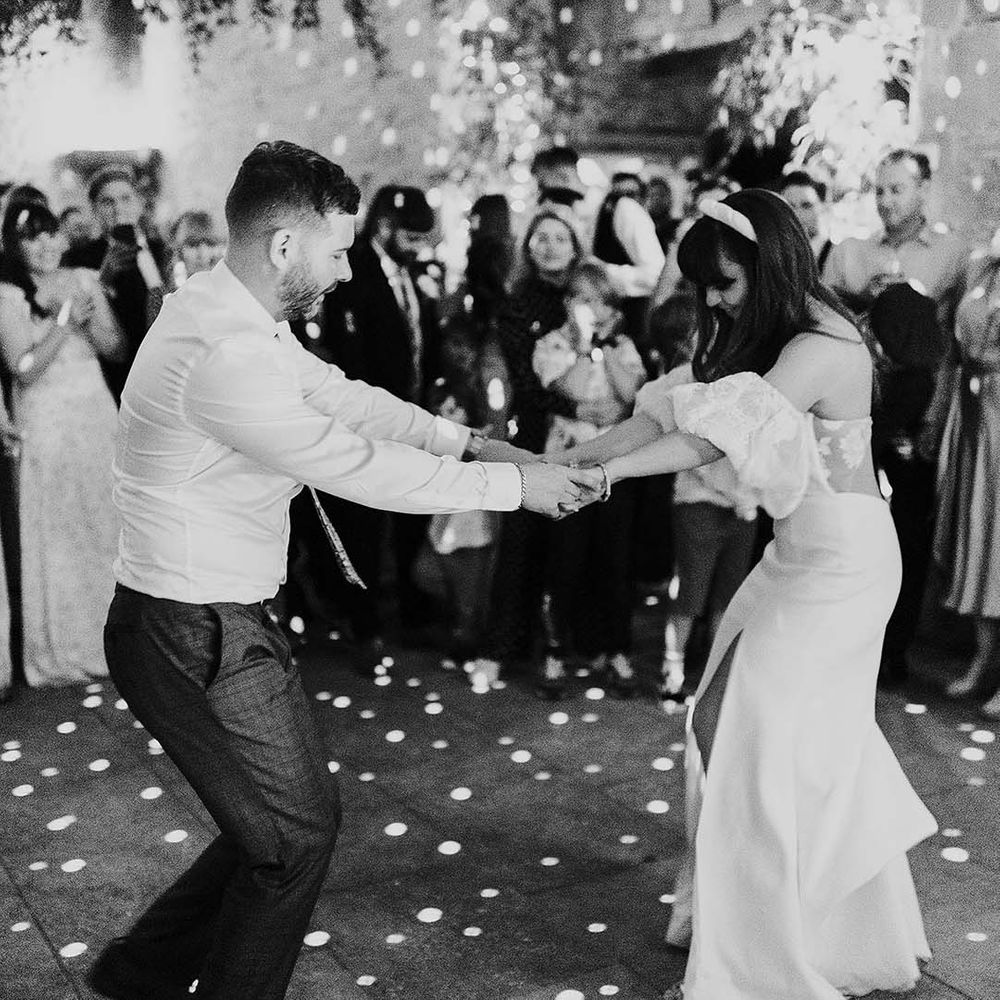 Bride & groom dance on their wedding day during reception party