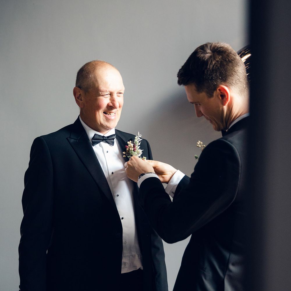 Black tie wedding with floral buttonholes