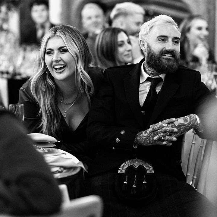 Bridesmaid Jamie Genevieve with husband in kilt for autumnal Scottish wedding
