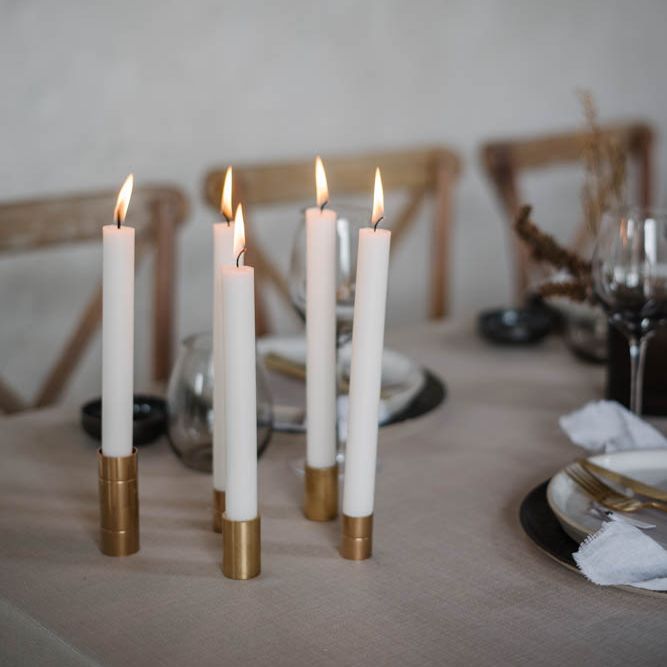 taper candles in gold candlesticks 