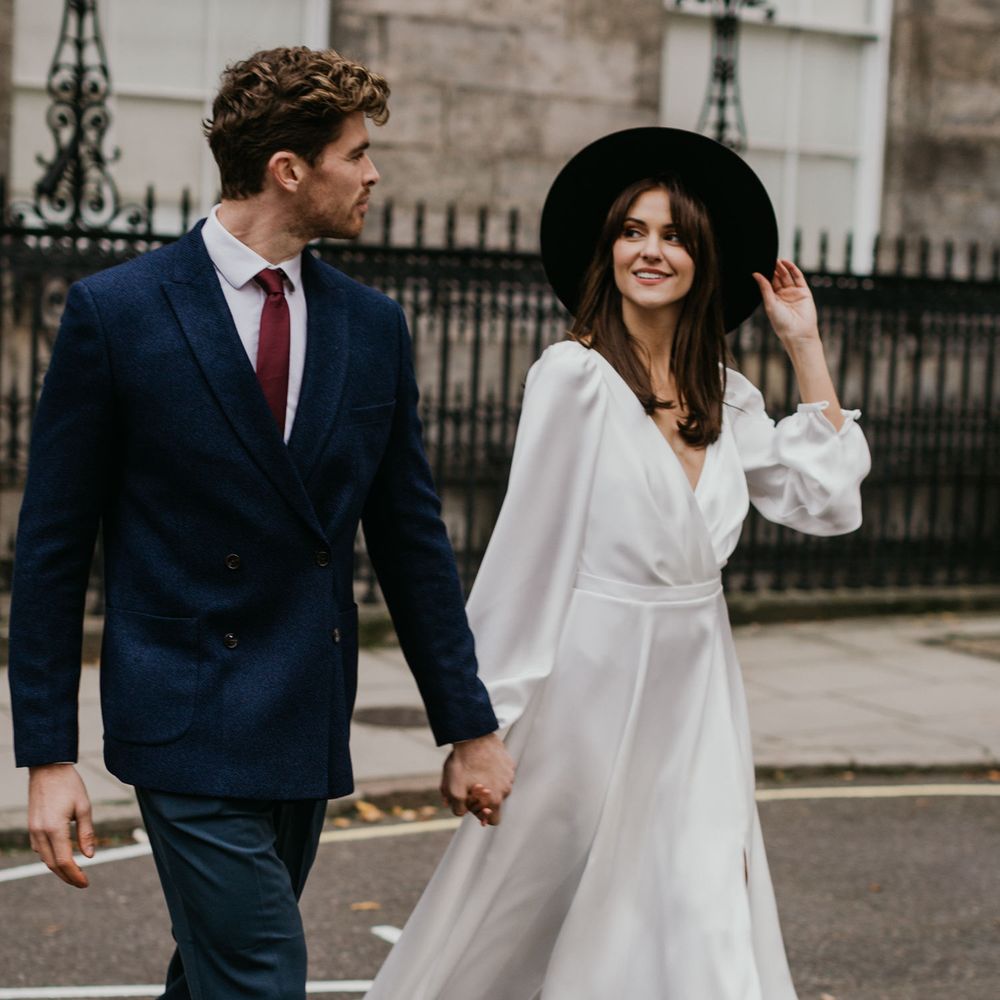 Bride and groom crossing the road at London intimate wedding 