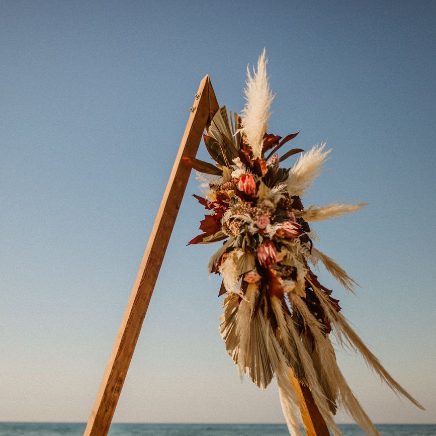 Close up of triangular altar construction for beach wedding in Crete