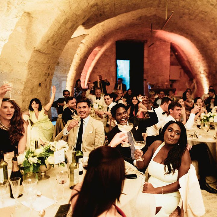 Wedding guests gather during reception meal