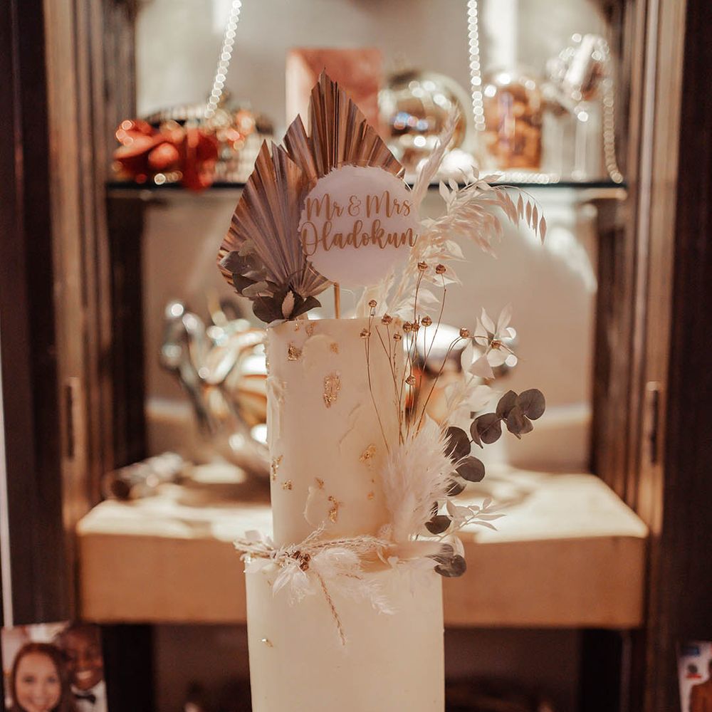 2 tier wedding cake complete with white frosting 