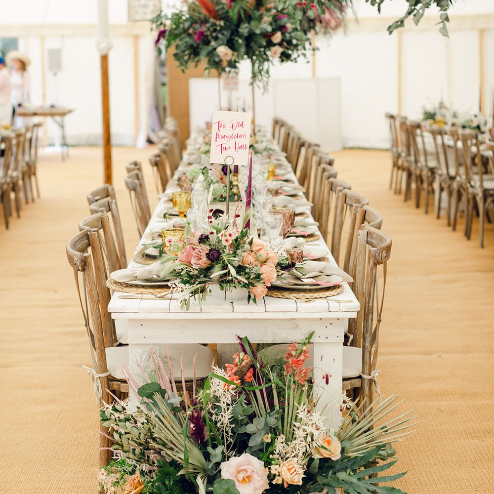 Beautiful pink wedding flower and foliage decor with pampas grass at marquee wedding