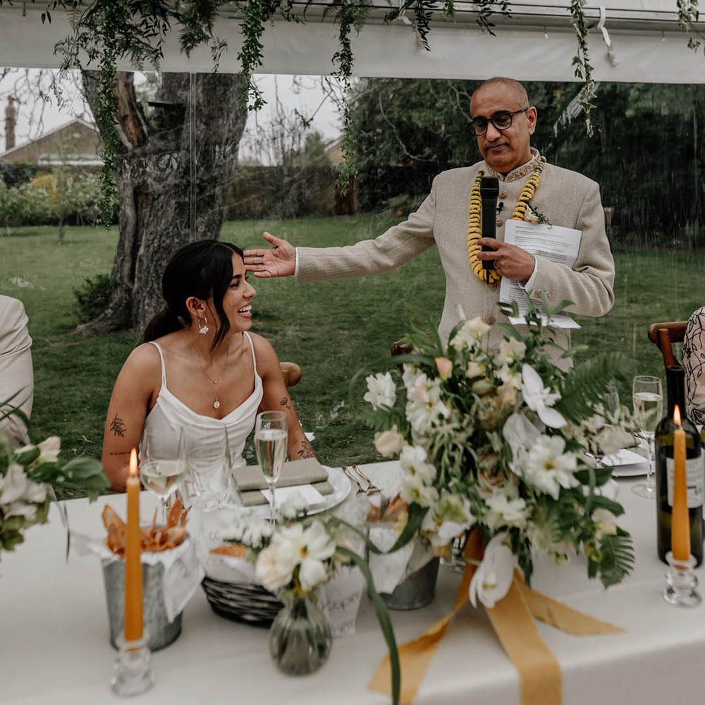 Father of the bride speech in a clear glass marquee reception at home 
