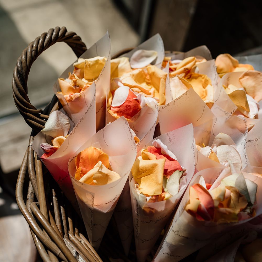 Rose petal confetti in a wicker basket