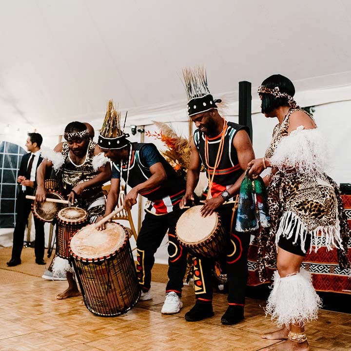 Adanta wedding dancers with drums at Broadfield Court wedding celebrating Nigerian and Chinese wedding traditions