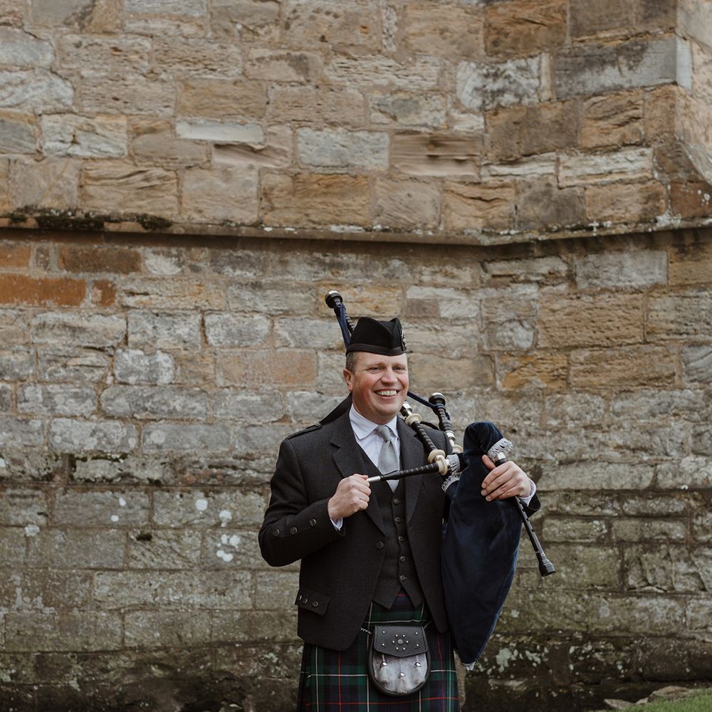 Bagpipe wedding entertainment playing as guests walk into ceremony 