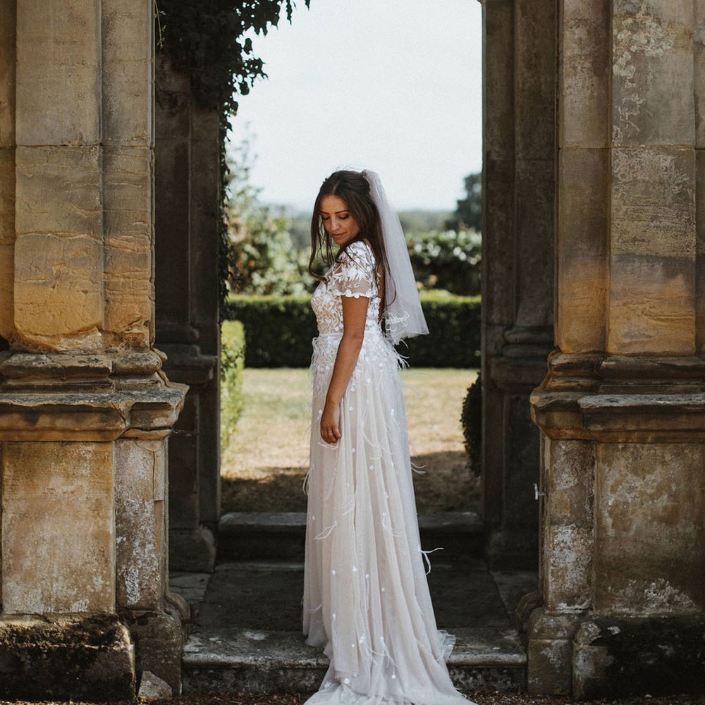 living floral runners for marquee wedding with bride in hermione de paula james frost photography 1