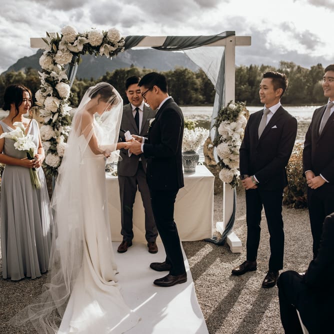 Bride and groom exchanging vows at outdoor wedding in Austria 