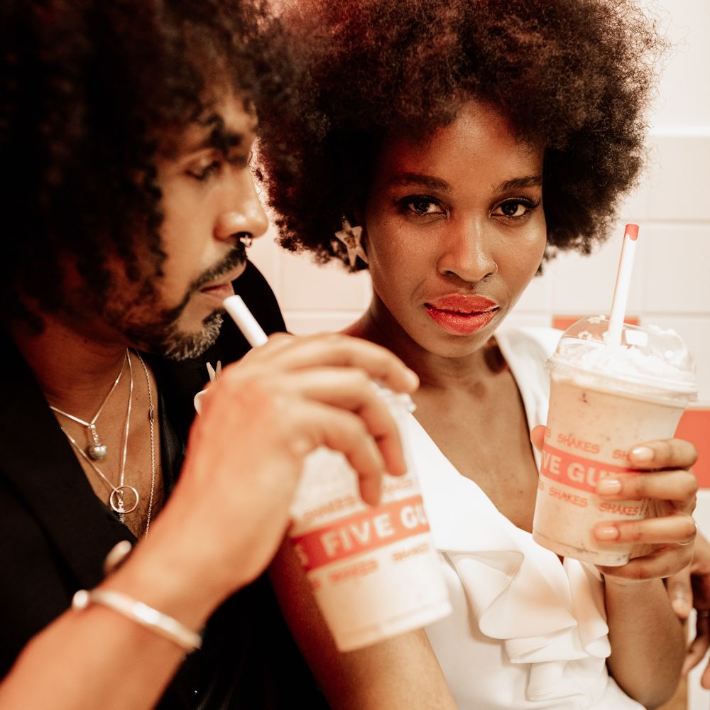 Bride & groom sit together 