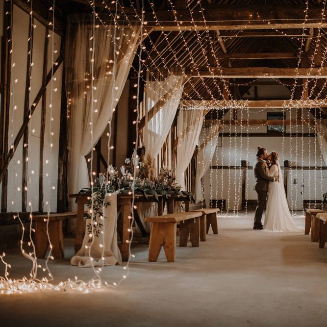 Fairy light lit barn wedding for boho luxe wedding