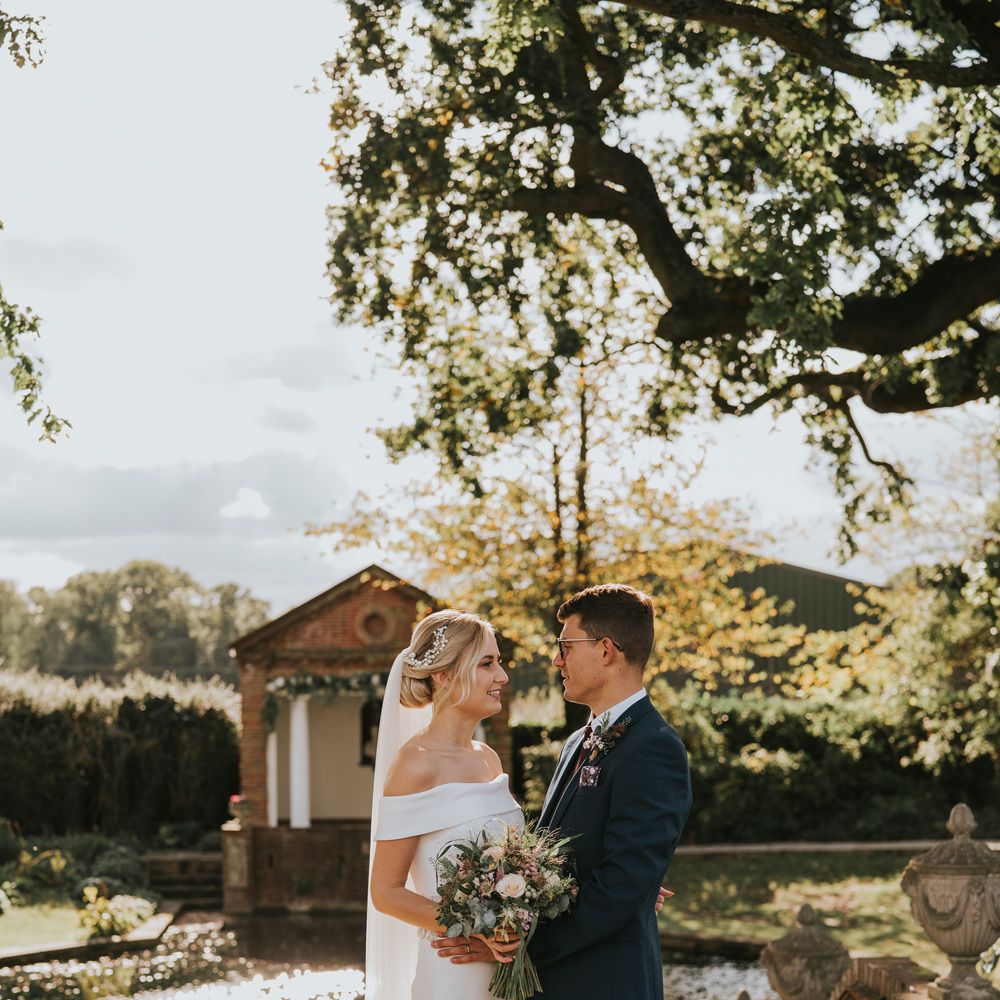 Bride & groom look at one another after wedding ceremony