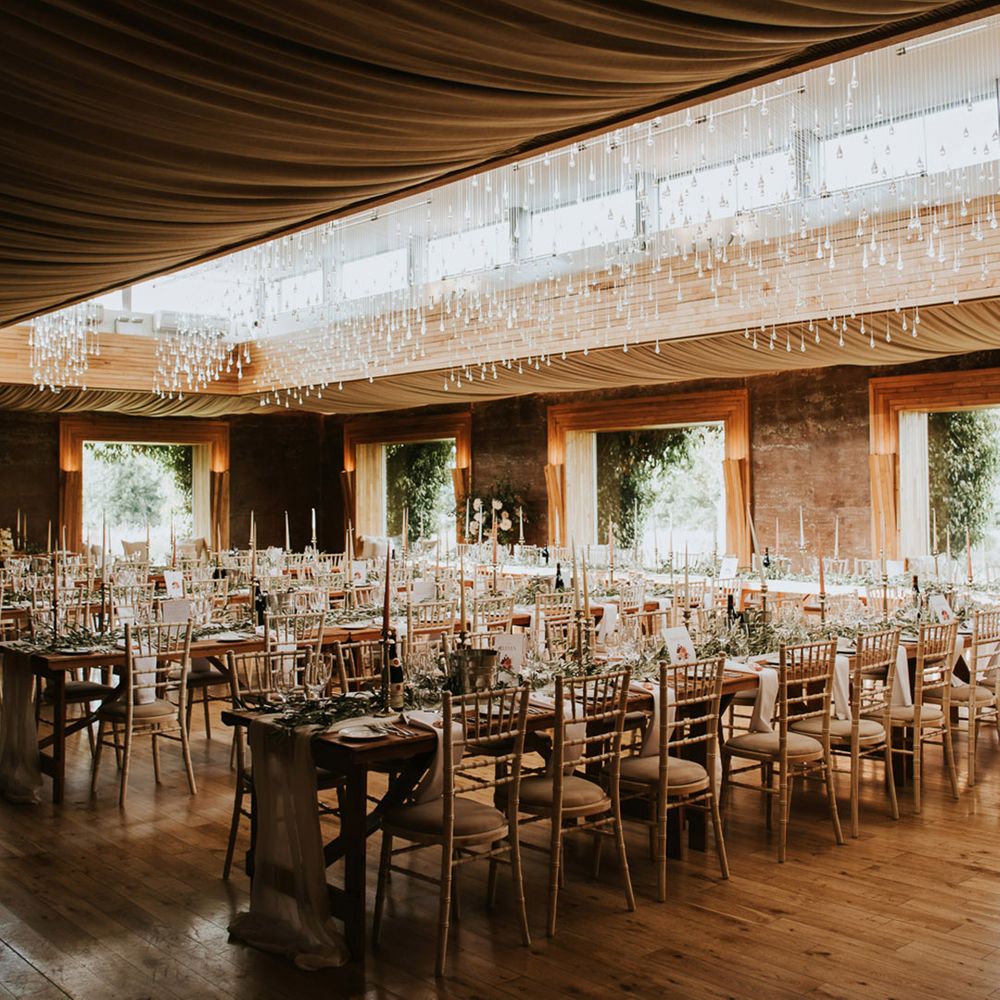 Romanic wedding in the Gillyflower at Elmore Court with candles and foliage table decor