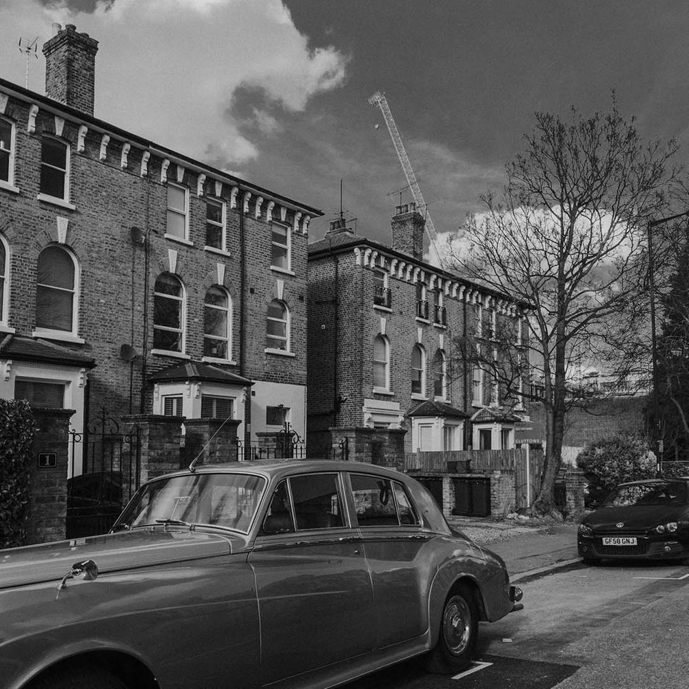 black and white picture of a vintage wedding car 