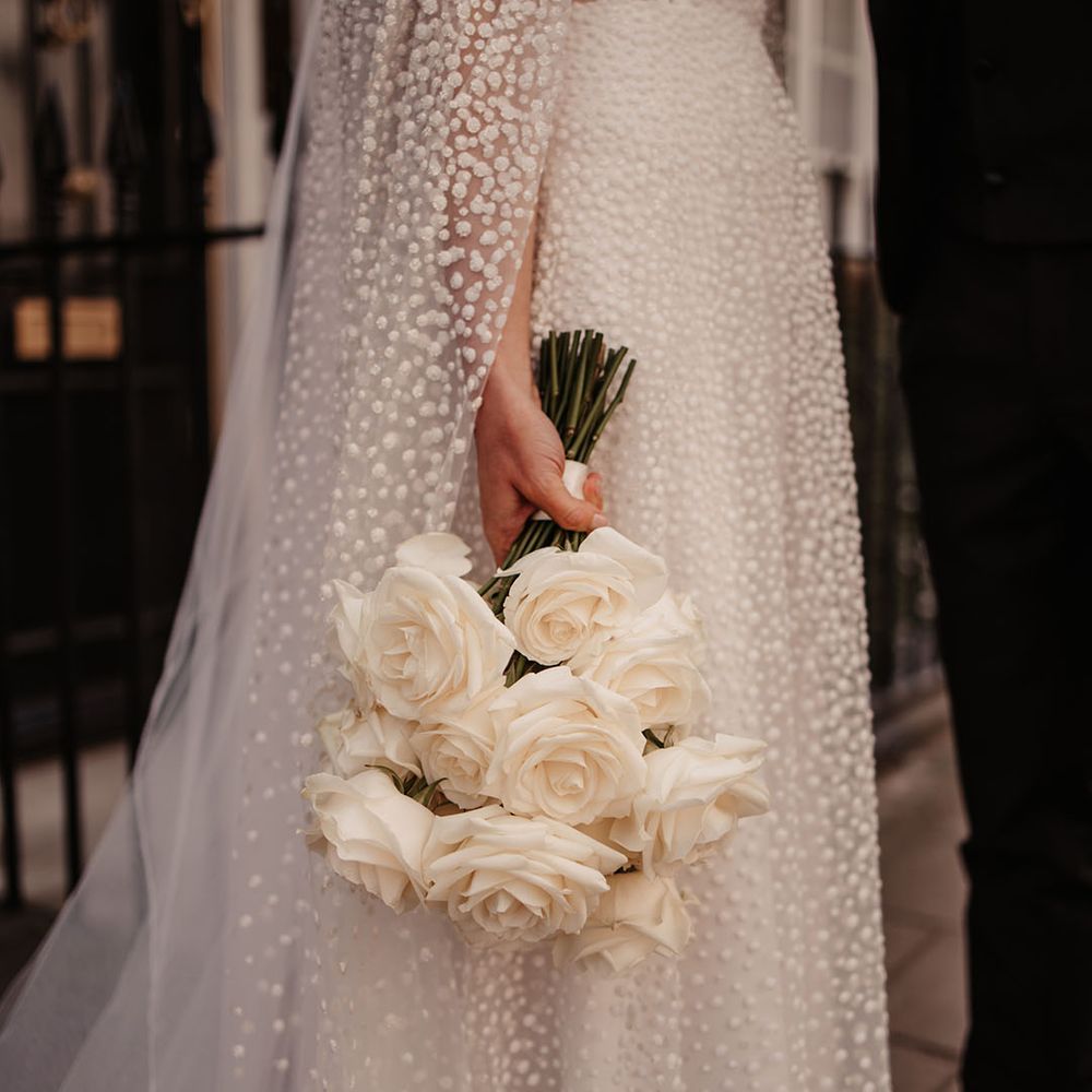 Jesus Peiro wedding dress with white rose bouquet 