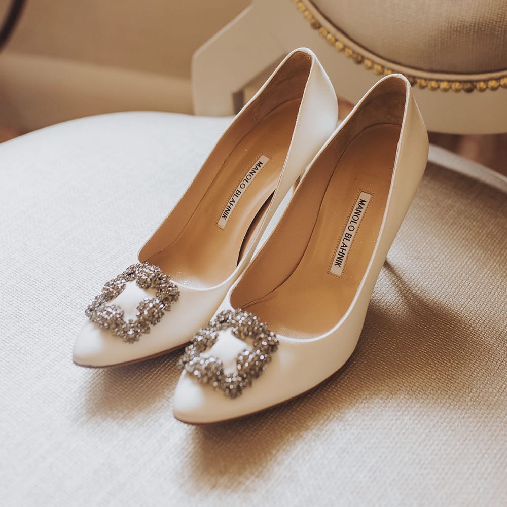 White Manolo Blahnik heels complete with embellishment to the front