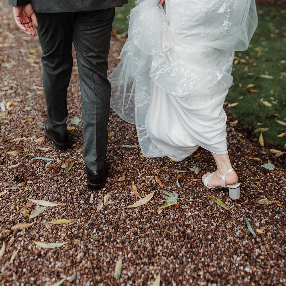 Bride in block heel wedding shoes in lace wedding gown 