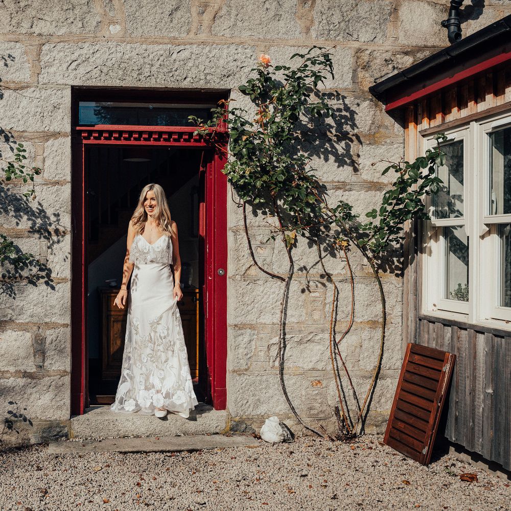 Bride in doorway on the morning of her wedding