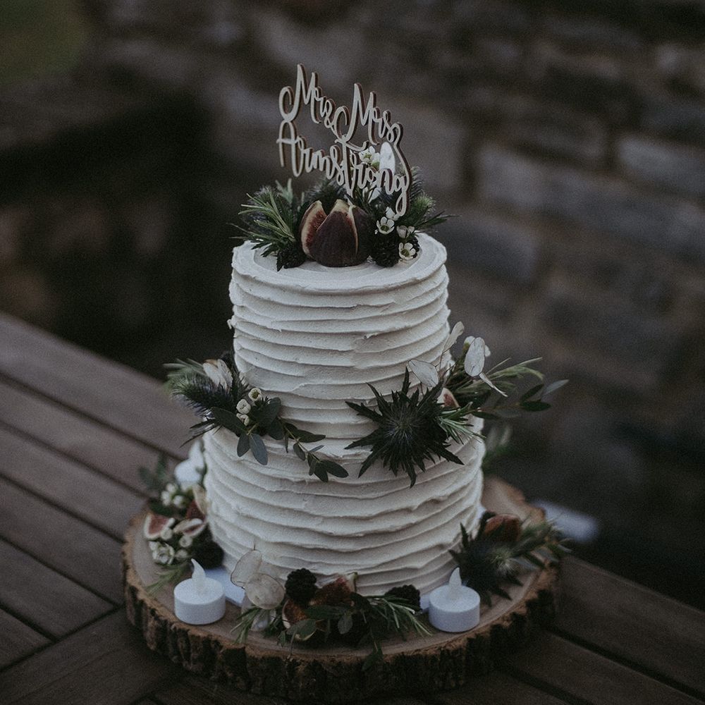 White frosted wedding cake with floral decor 