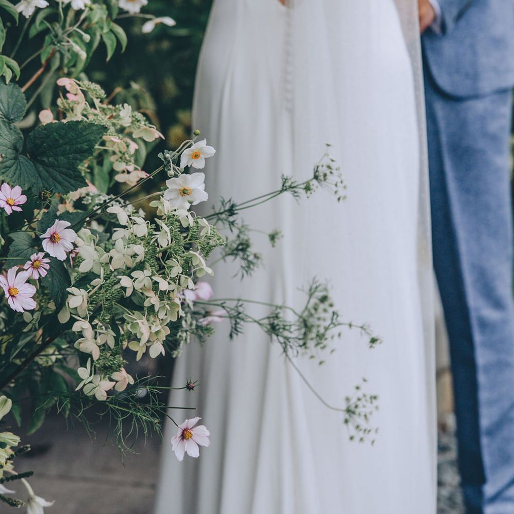 Low button back wedding dress with veil