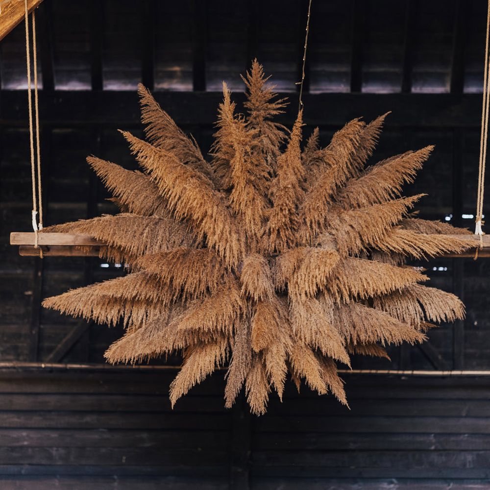 Ceiling pampas arrangements at Boho Barn wedding