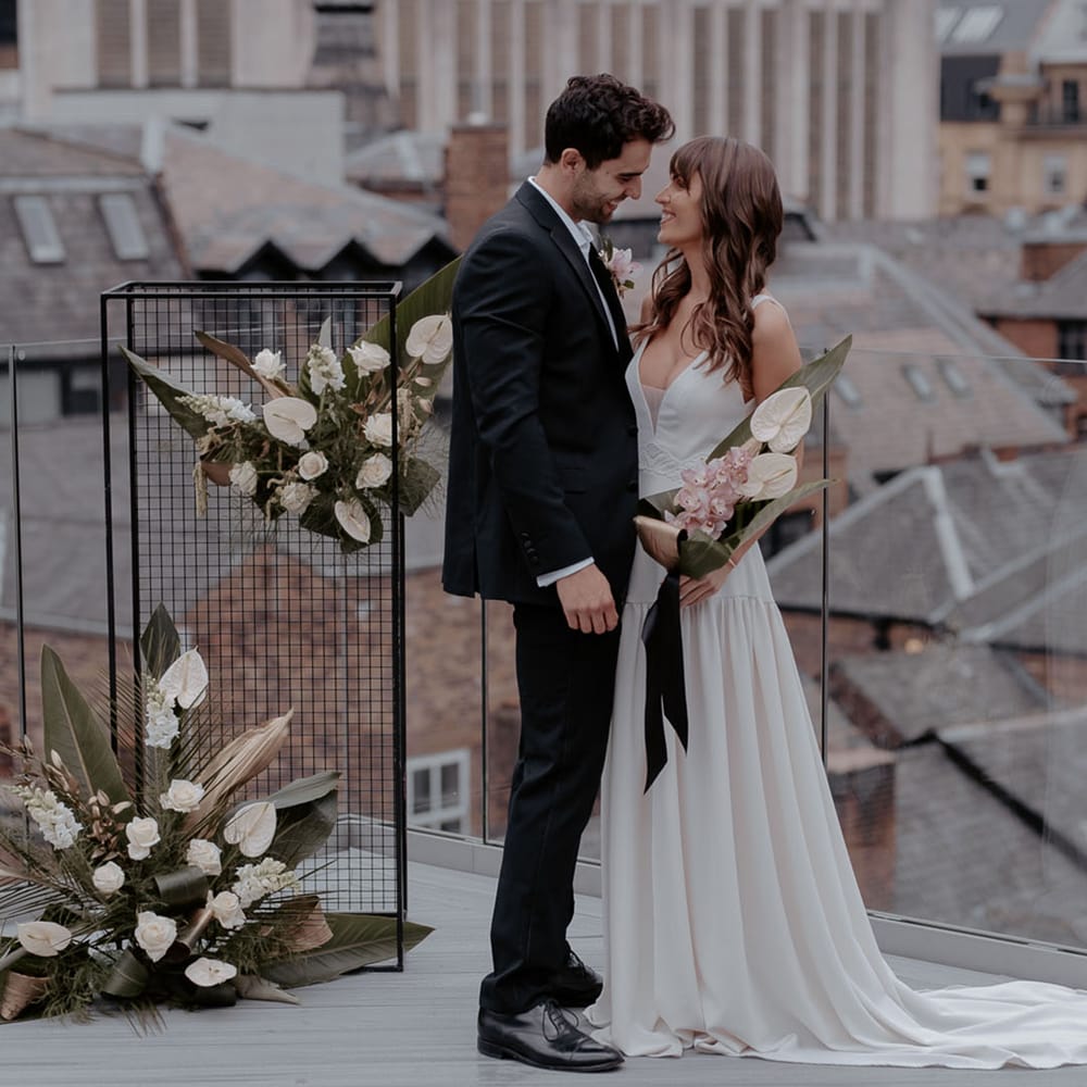 Urban jungle wedding inspiration at Manchester Hall with tropical flowers and Daniel Chu wedding dresses 