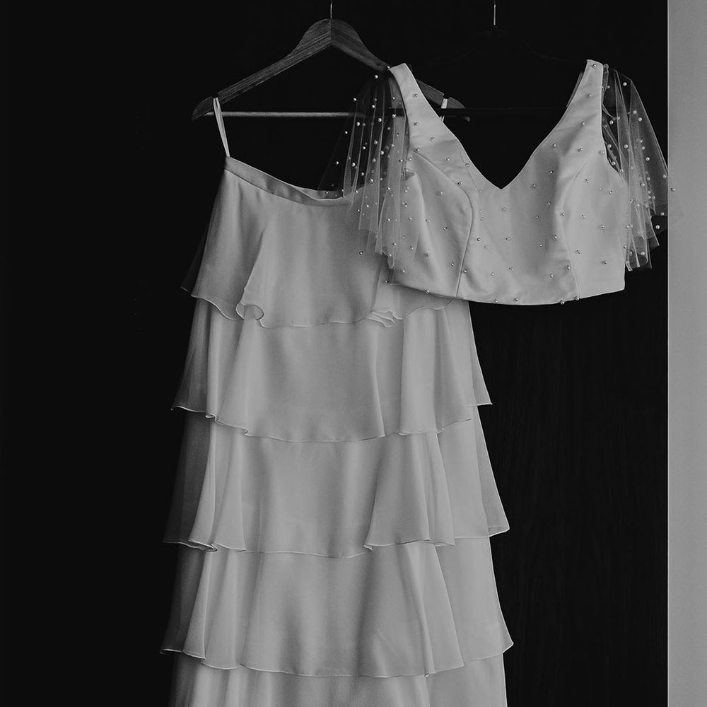 Bridal separates by Story Of My Dress with layered skirt and pearl top 