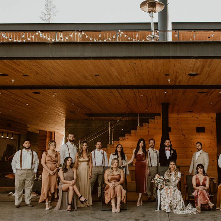 Bride & groom stand with their wedding party