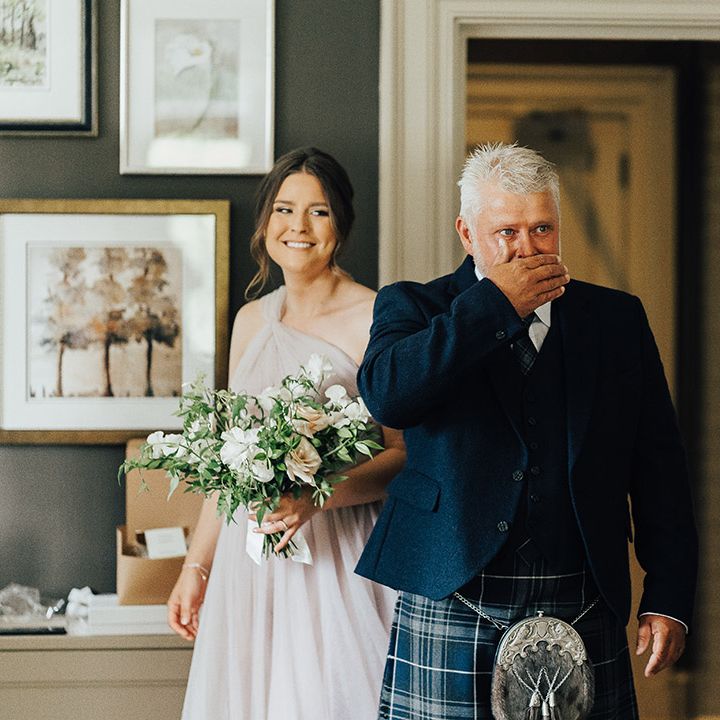 Father of the bride first look in a navy blue tartan kilt and sporran 