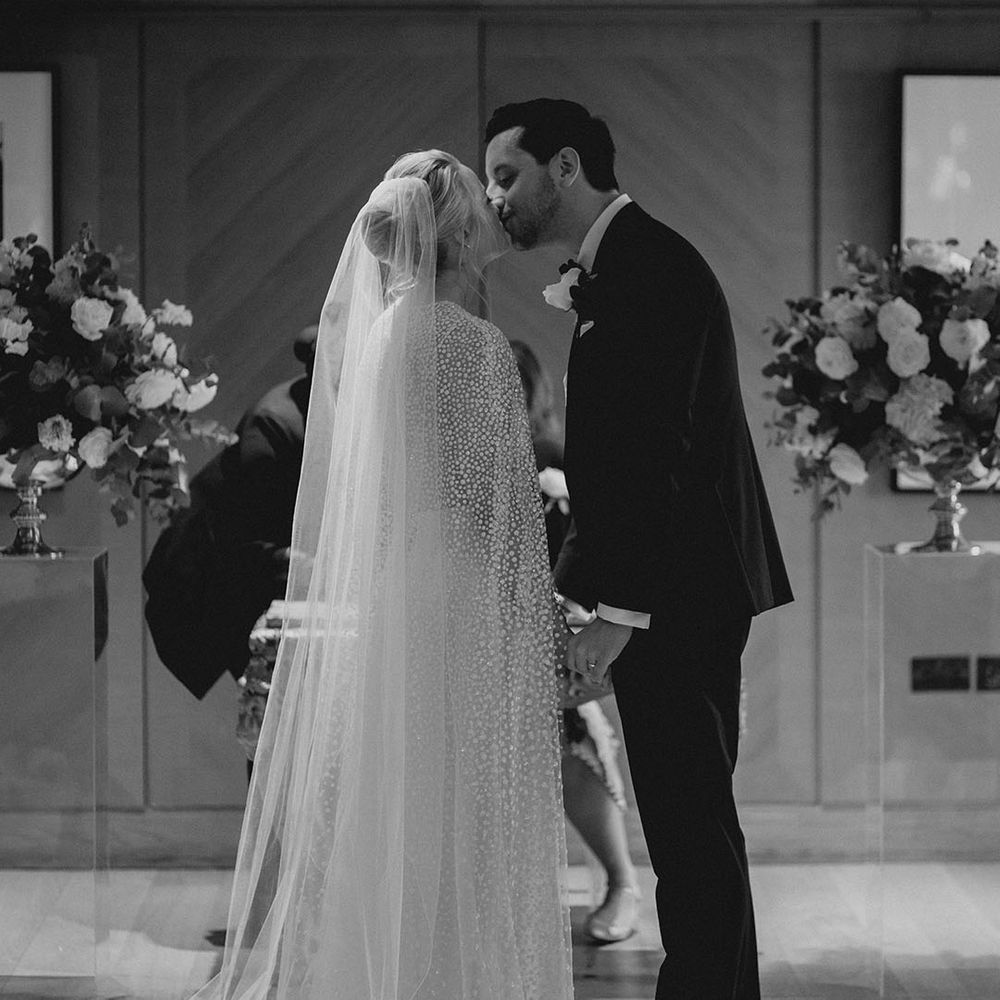 Bride and groom share their first kiss as a married couple 