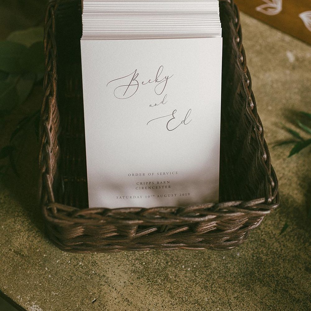 Order of service cards in wicker baskets 