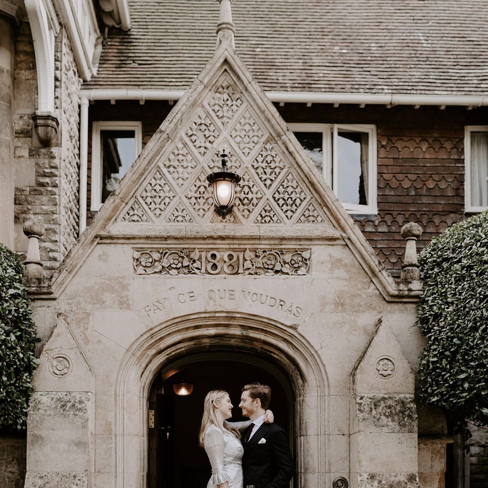 Normanton Church wedding with the bride and groom celebrating together at the entrance 